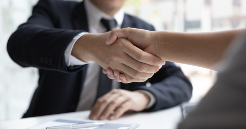 Hand shake between interviewer and hiring manager