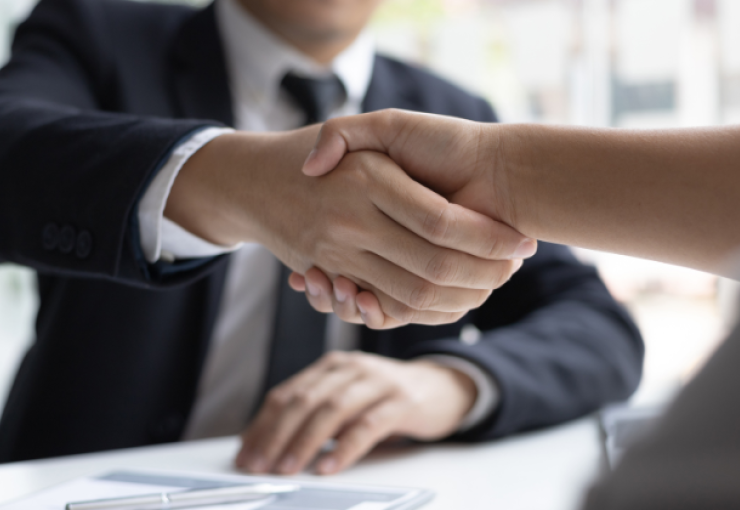 Hand shake between interviewer and hiring manager